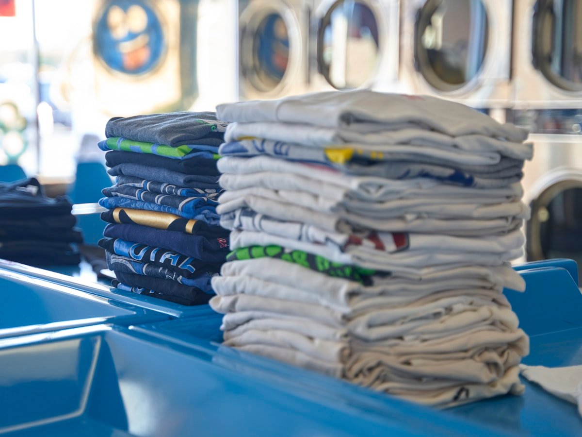 Neat stacks of folded and sorted clothes ready for delivery